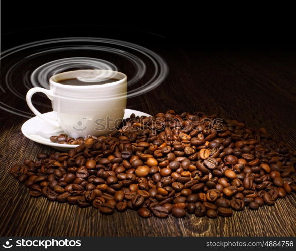 Image of coffee beans and white cup