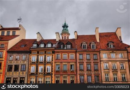 Image of colorful old houses in the main town square in Warsaw, Poland enhanced by use of HDR techniques