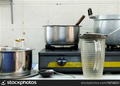 image of Cooking food on kitchen with steel oven, pots
