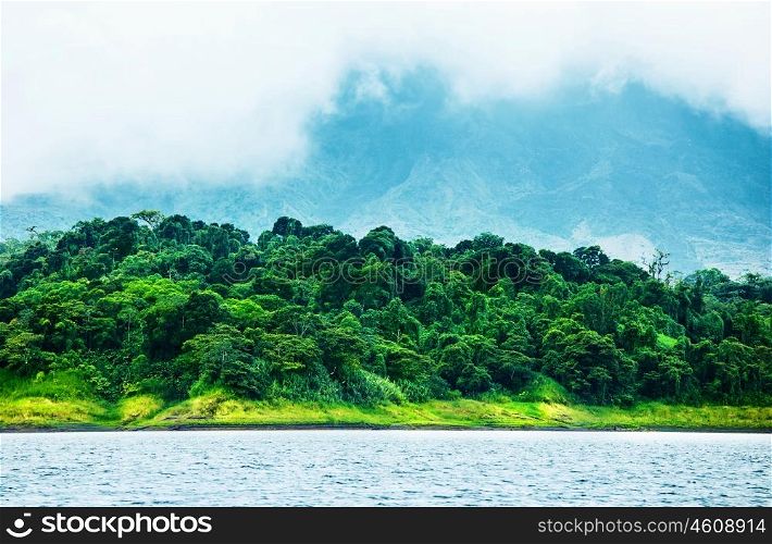 Image of Costa Rica, nature of Central America, fog in the mountains, green forest near river, beautiful landscape, eco tourism, panoramic scene, peaceful nature, travel and vacation concept