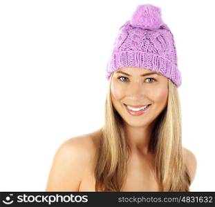 Image of cute blond girl wearing pink winter hat, closeup portrait of beautiful young lady in warm wool cap isolated on white background, wintertime fashion, Christmas style, happiness concept
