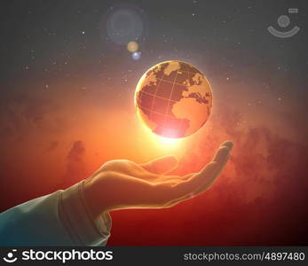 Image of earth planet on hand. Hand of businessman holding earth planet against illustration background