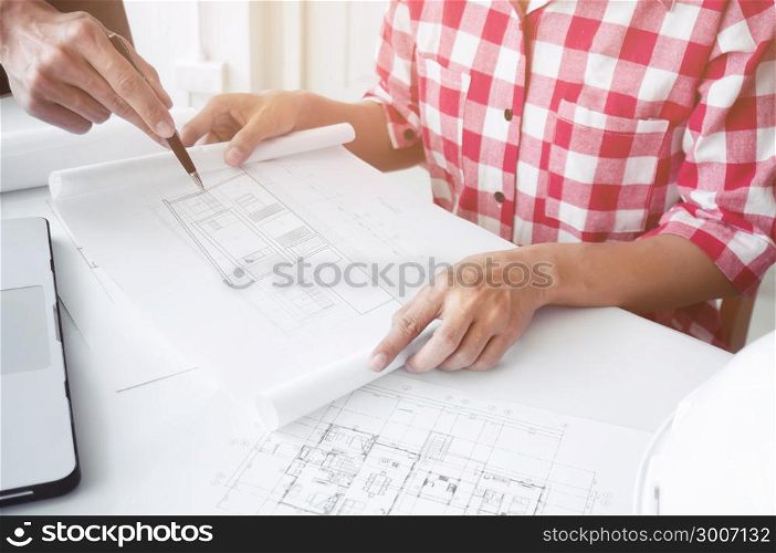 Image of engineer architect working on blue print - plan and construction
