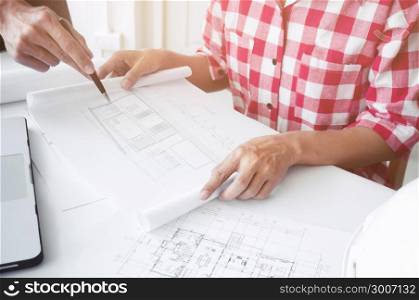 Image of engineer architect working on blue print - plan and construction