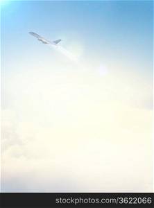 Image of flying airplane in clear sky with sun at background