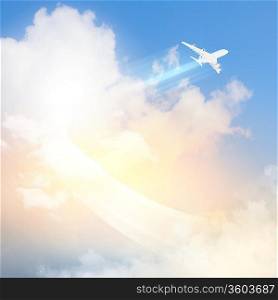 Image of flying airplane in sky with clouds at background