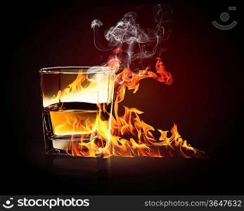 Image of glass of burning yellow absinthe