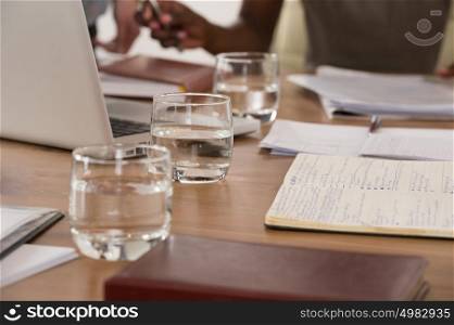 Image of glasses of water during discussion at meeting