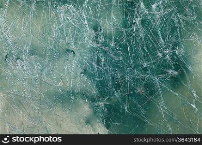 Image of green glass texture close-up with scratches over surface