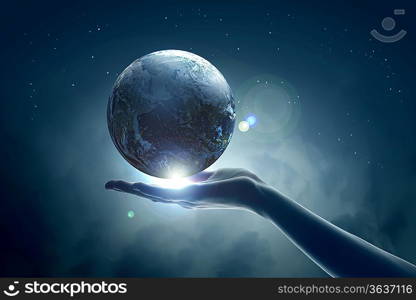 Image of hand holding earth planet against illustration background