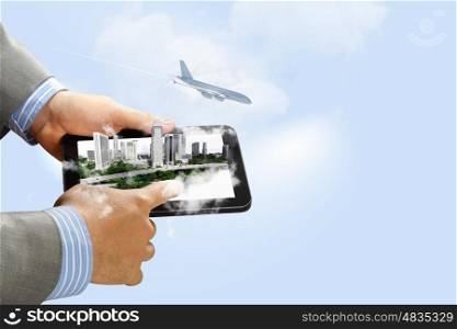 Image of hands touching pad. Image of businessman hands touching pad with virtual illustration