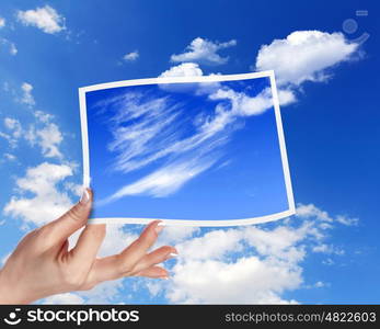 Image of light blue sky with white cloudes with frames