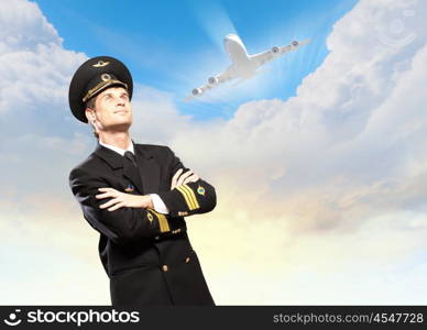 Image of male pilot. Image of male pilot with airplane at background