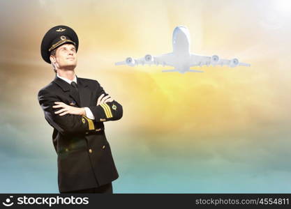 Image of male pilot. Image of male pilot with airplane at background