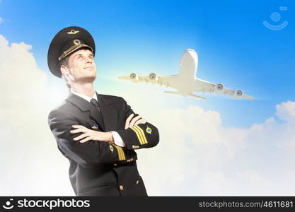 Image of male pilot. Image of male pilot with airplane at background