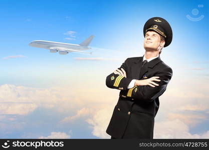 Image of male pilot. Image of male pilot with airplane at background