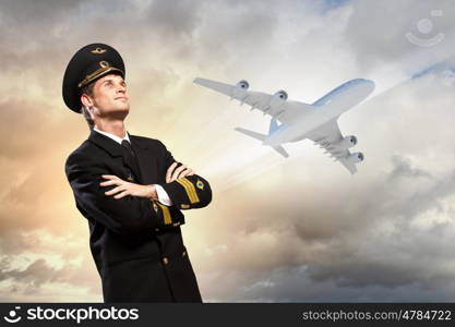 Image of male pilot. Image of male pilot with airplane at background