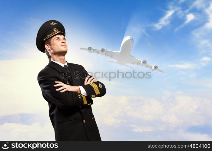 Image of male pilot. Image of male pilot with airplane at background