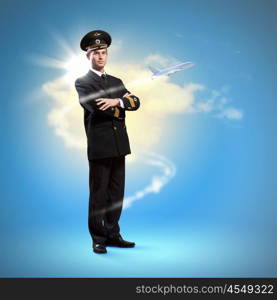 Image of male pilot. Image of male pilot with airplane flying around him