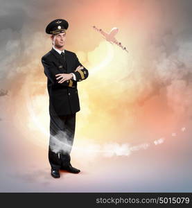 Image of male pilot. Image of male pilot with airplane flying around him