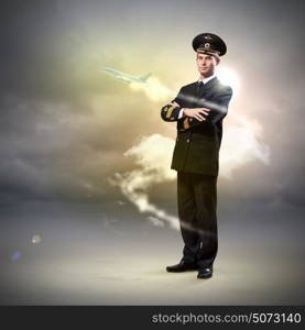 Image of male pilot. Image of male pilot with airplane flying around him