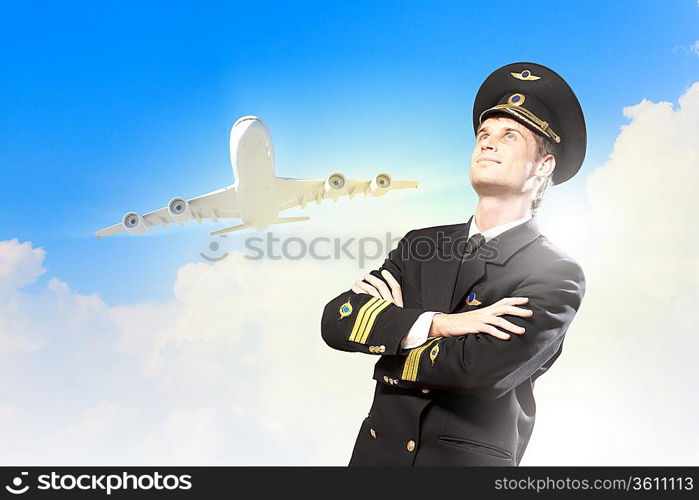 Image of male pilot with airplane at background