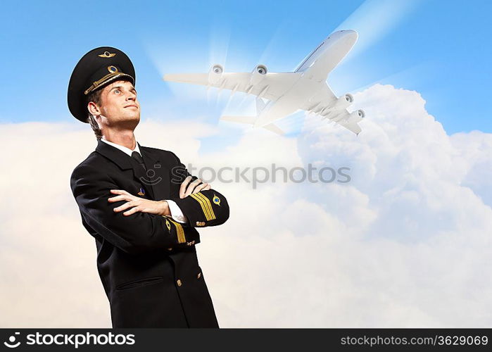 Image of male pilot with airplane at background