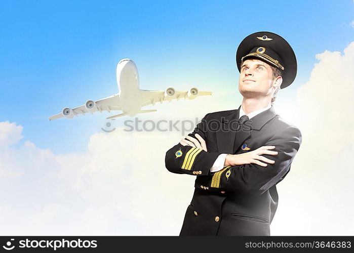 Image of male pilot with airplane at background