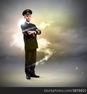 Image of male pilot with airplane flying around him