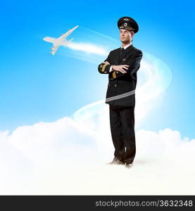 Image of male pilot with airplane flying around him