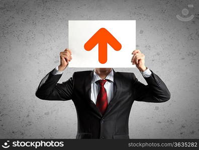 Image of man holding board with arrow picture