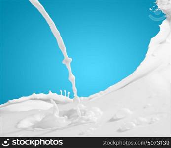Image of milk splashes. Image of milk splashes against color background