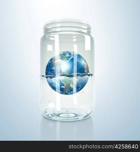 Image of our planet earth inside a glass jar