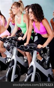image of people spinning on bicycles in a gym
