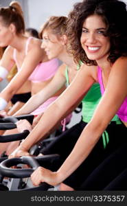 image of people spinning on bicycles in a gym