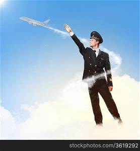 Image of pilot touching sky against airplane background