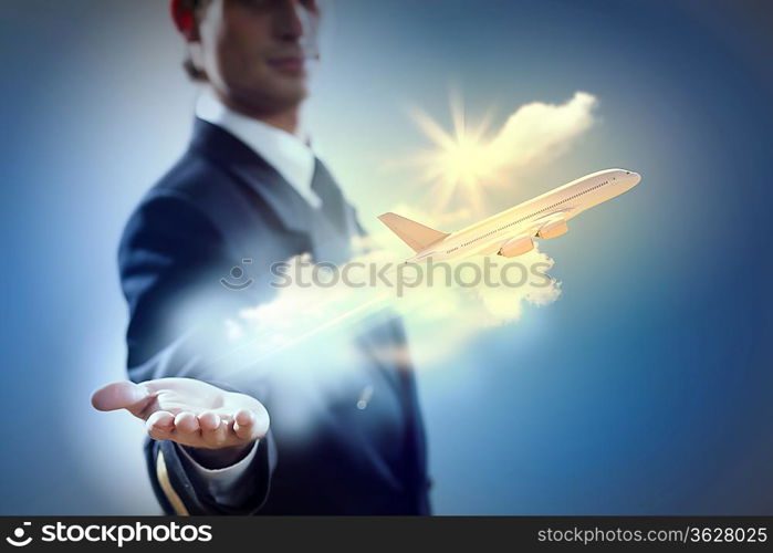 Image of pilot with airplane taking off from his hand