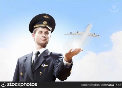 Image of pilot with plane in hand. Image of pilot with airplane taking off from his hand