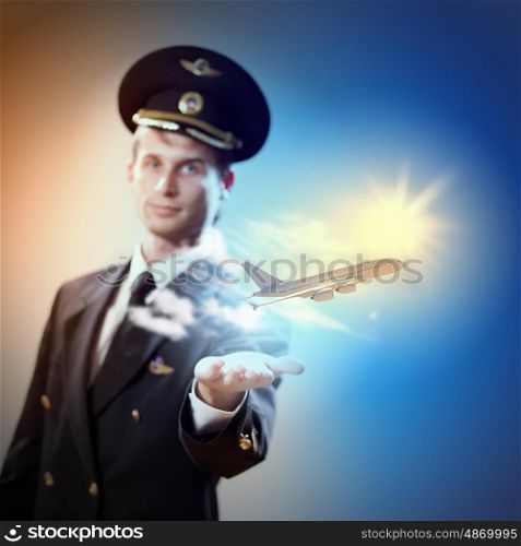 Image of pilot with plane in hand. Image of pilot with airplane taking off from his hand