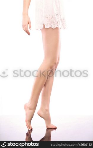 Image of plain, shaved legs of a young woman