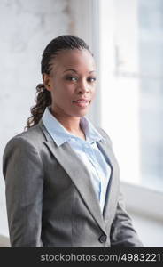 Image of pretty african businesswoman looking at camera