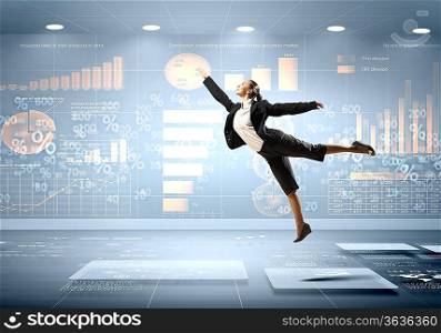 Image of pretty businesswoman jumping high against financial background