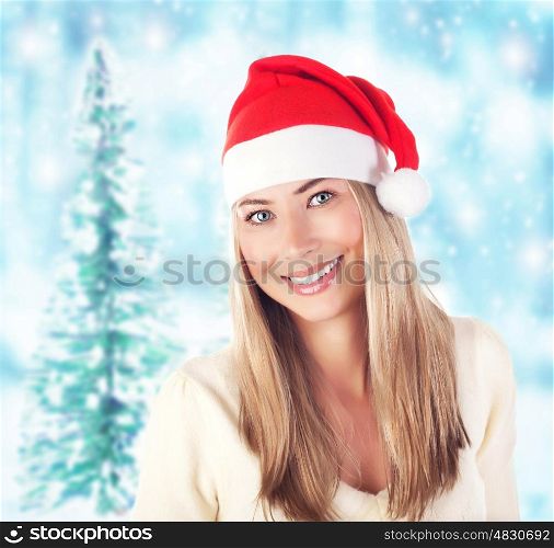 Image of pretty santa claus woman in winter forest, xmas eve, New Year holiday, beautiful smiling girl wearing red funny hat over snowy background, evergreen tree in wintertime, Merry Christmas&#xA;