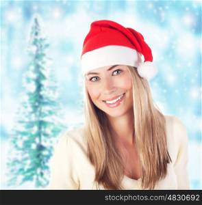 Image of pretty santa claus woman in winter forest, xmas eve, New Year holiday, beautiful smiling girl wearing red funny hat over snowy background, evergreen tree in wintertime, Merry Christmas&#xA;