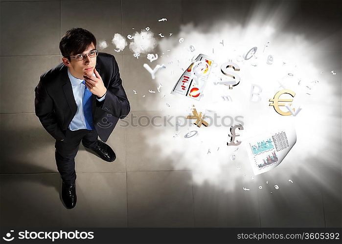 Image of printed materials flying in air top view against businessman background