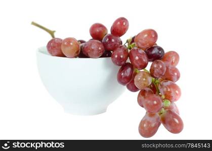 Image of red grapes in bowl on white