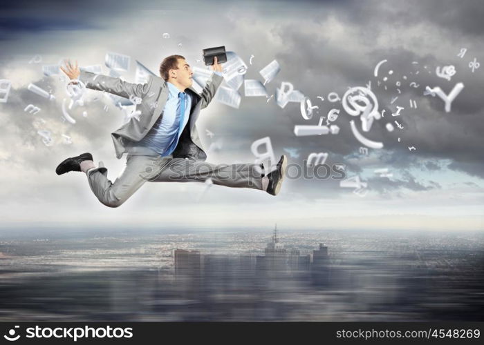 Image of running businessman. Image of a businessman jumping high against financial background