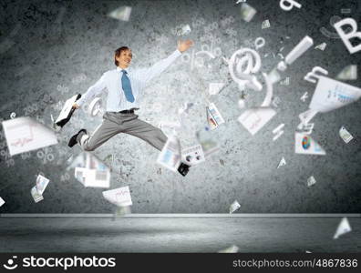 Image of running businessman. Image of a businessman jumping high against financial background