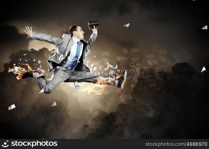 Image of running businessman. Image of a businessman jumping high against financial background