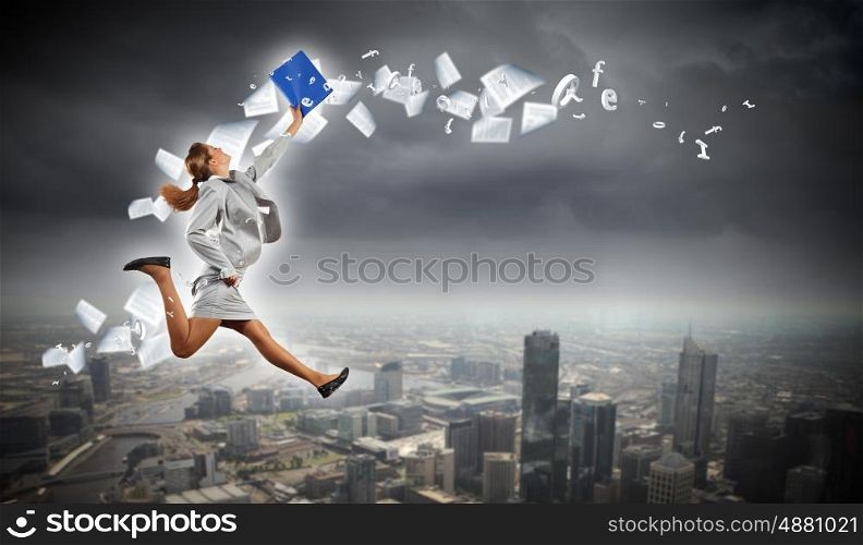 Image of running businesswoman. Image of a businesswoman jumping high against financial background